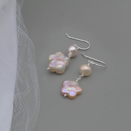 Round and intricately detailed freshwater pearls, gracefully suspended from Sterling Silver fishhook ear-wires.