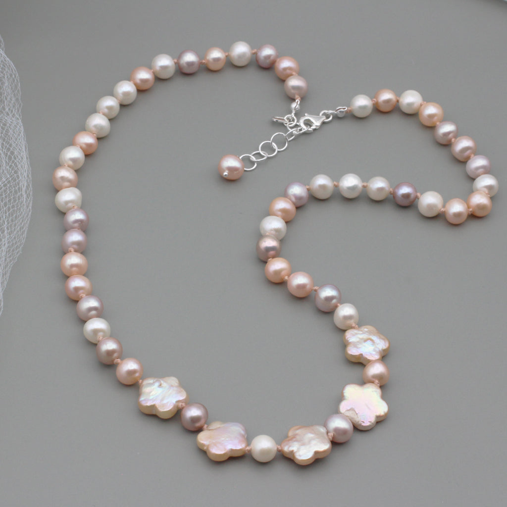 Round and intricate botanical Freshwater Pearls, tightly bound together by silk. The Sterling Silver Lobster clasp is secured with a 2inch extender chain.