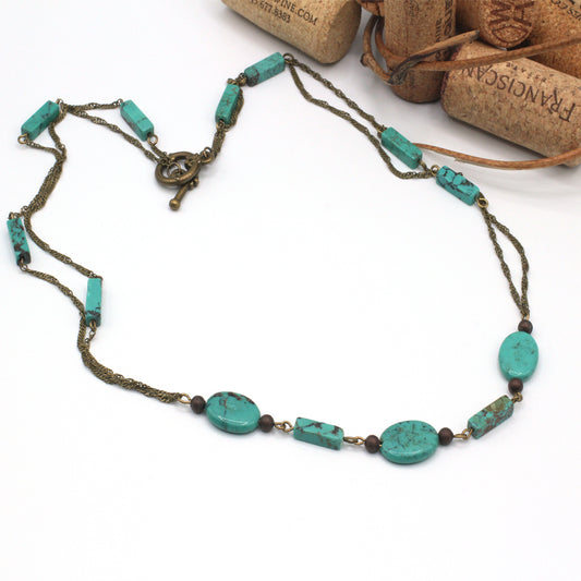Necklace with turquoise beads on a white background