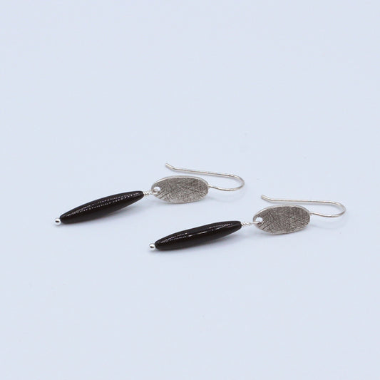 Earrings of black obsidian with softly textured silver electroplated accents 