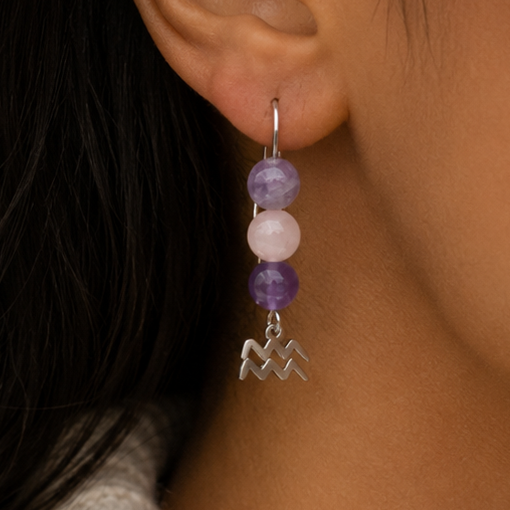 Express the individual spirit of Aquarius with earrings featuring Amethyst, Rose Quartz, and Lepidolite—a gemstone trio symbolizing vision, compassion, and balance.