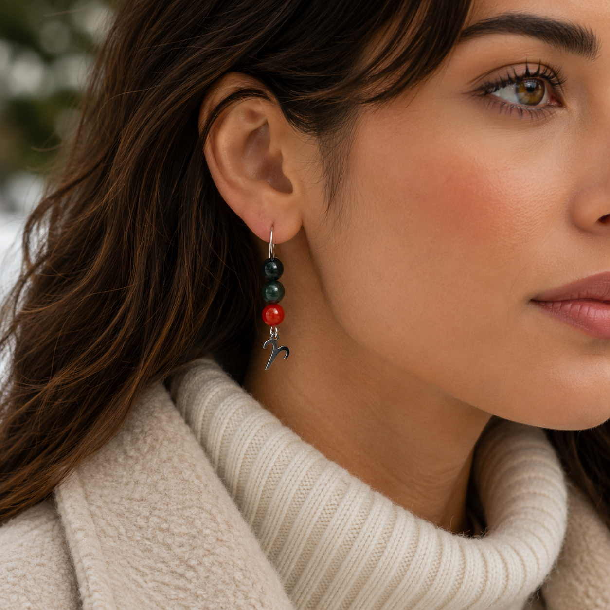 Embrace the fiery spirit of Aries with earrings featuring Carnelian, Bloodstone, and Obsidian—a bold gemstone trio symbolizing courage, strength, and protection.Finished with an Aries symbolic charm and suspended from a hand-forged earwire.