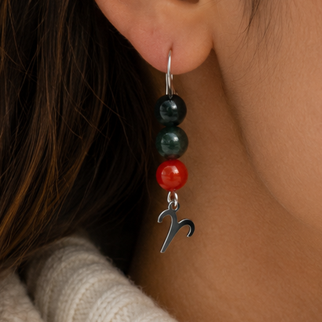 Embrace the fiery spirit of Aries with earrings featuring Carnelian, Bloodstone, and Obsidian—a bold gemstone trio symbolizing courage, strength, and protection.Finished with an Aries symbolic charm and suspended from a hand-forged earwire.