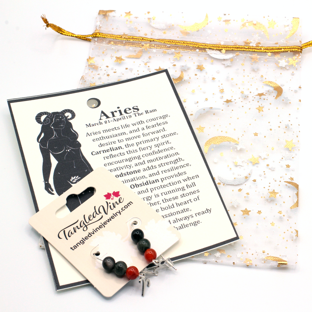 Embrace the fiery spirit of Aries with earrings featuring Carnelian, Bloodstone, and Obsidian—a bold gemstone trio symbolizing courage, strength, and protection.Finished with an Aries symbolic charm and suspended from a hand-forged earwire.