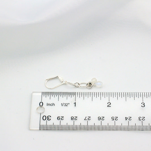 Moonstone cube earrings on silver chain with lever-back ear-wires.