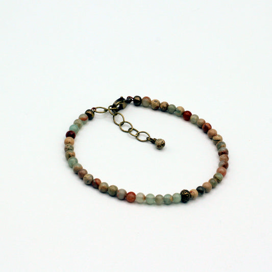 Adorn your wrist with these exquisite Bumble Bee Jasper gemstones, crafted for elegance and style.
