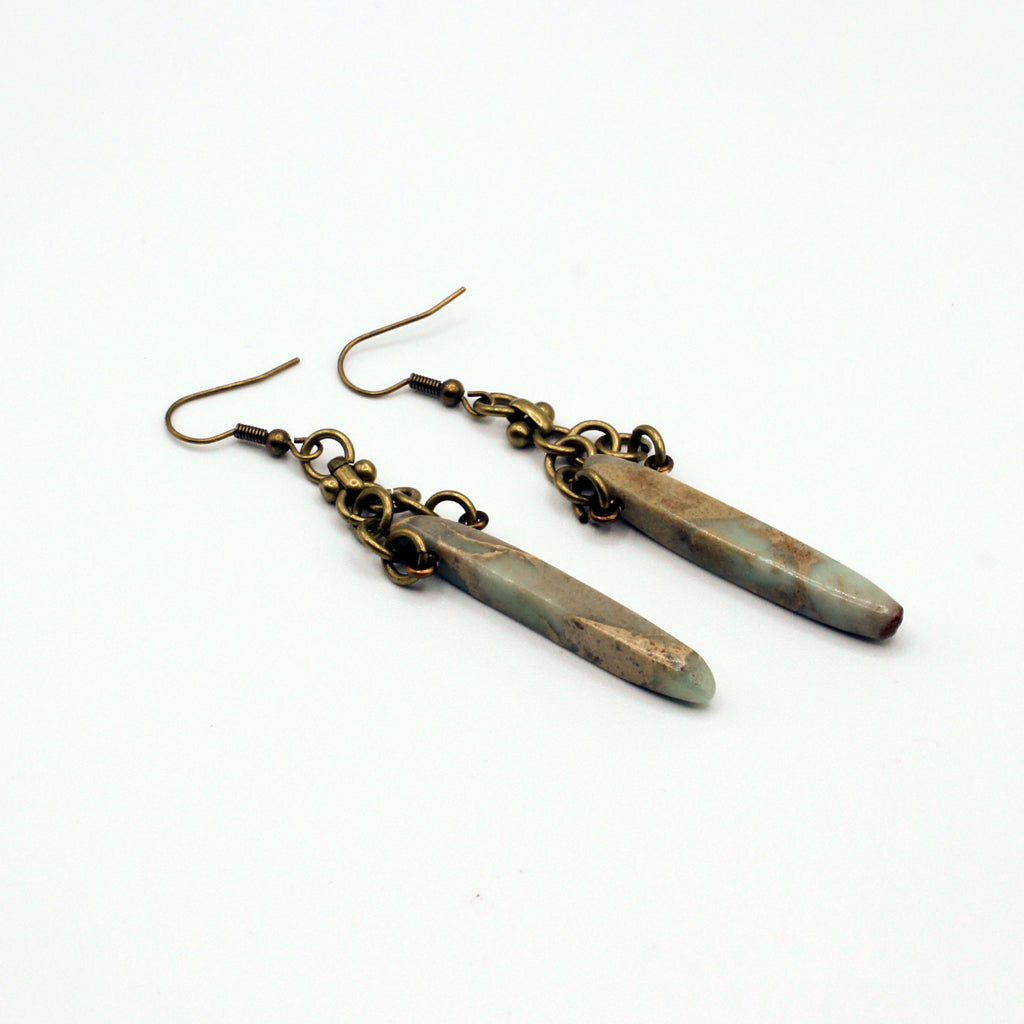 Bold earrings featuring Bumble Bee Jasper Dagger Gemstones paired with a distinctive antique bronze chain for a dynamic dangle effect.