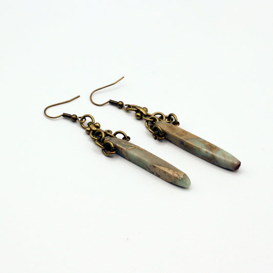 Bold earrings featuring Bumble Bee Jasper Dagger Gemstones paired with a distinctive antique bronze chain for a dynamic dangle effect.
