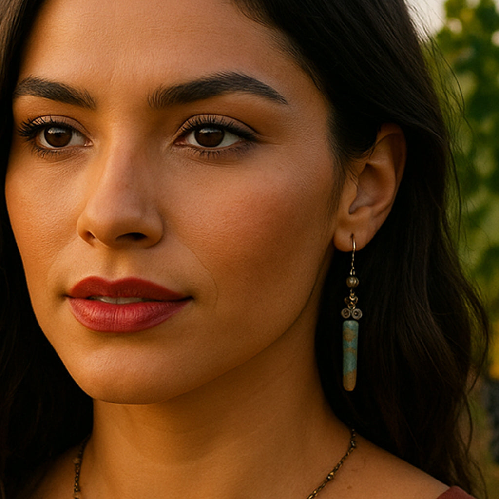 Bold earrings featuring Bumble Bee Jasper Dagger Gemstones paired with a distinctive antique bronze chain for a dynamic dangle effect.