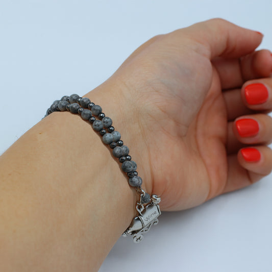 This double memory wire bracelet showcases a cute "wine bottle" charm, making it an ideal accessory for celebrating special moments