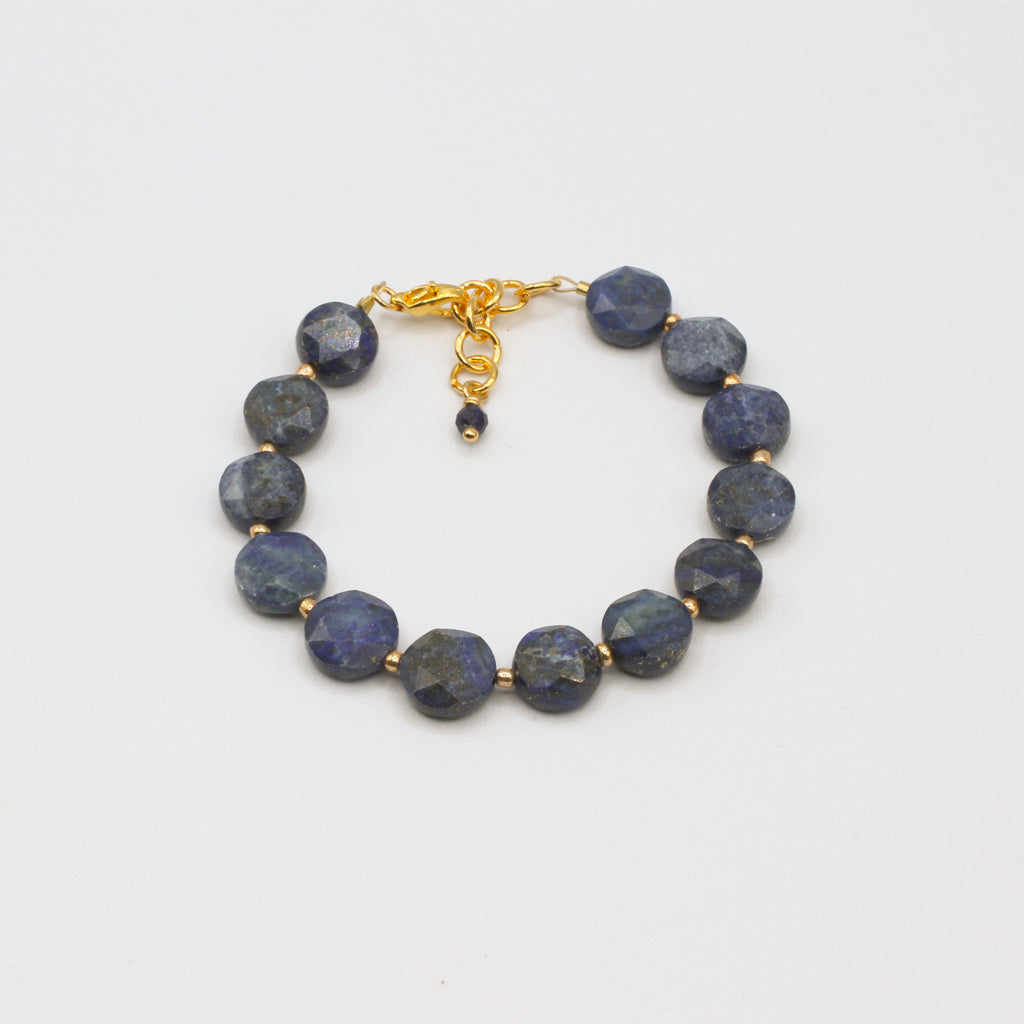 The Sol Lazuli bracelet showcases vibrant faceted Lapis Lazuli stones, accented by fine gold spacer beads.