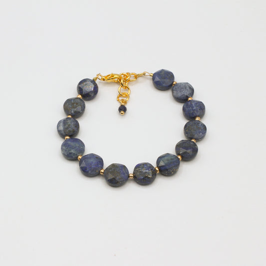 The Sol Lazuli bracelet showcases vibrant faceted Lapis Lazuli stones, accented by fine gold spacer beads.