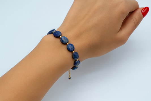 The Sol Lazuli bracelet showcases vibrant faceted Lapis Lazuli stones, accented by fine gold spacer beads.