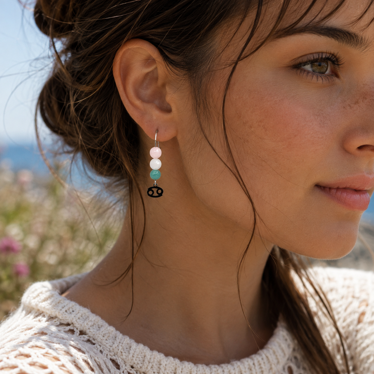 Honor the nurturing spirit of Cancer with earrings featuring Amazonite, Moonstone, and Rose Quartz—a gentle gemstone trio representing harmony, intuition, and love.Finished with a Cancer symbolic charm and suspended from a hand-forged earwire.