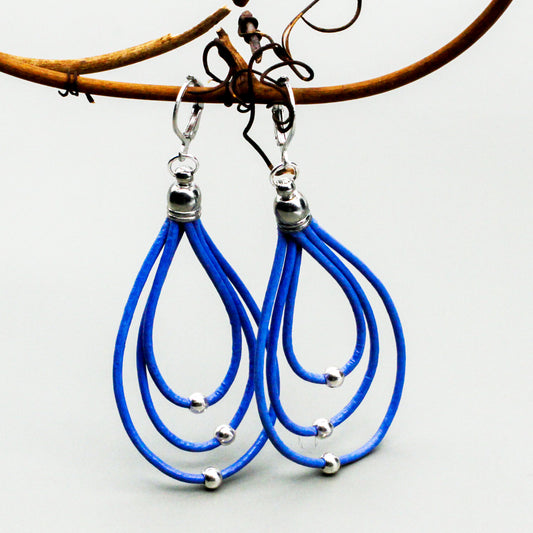 Leather hoop earrings with pewter beads hanging from a secure Lever-back ear wire.