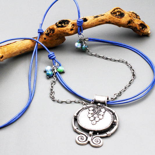 Adjustable necklace features a grape-inspired focal on a trendy leather cord. Adjust it to your preferred length and unleash your inner fashionista.