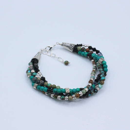 This multi 4 layer bracelet, adjustable from 6 1/2" to 7 1/2" with a chain extender,