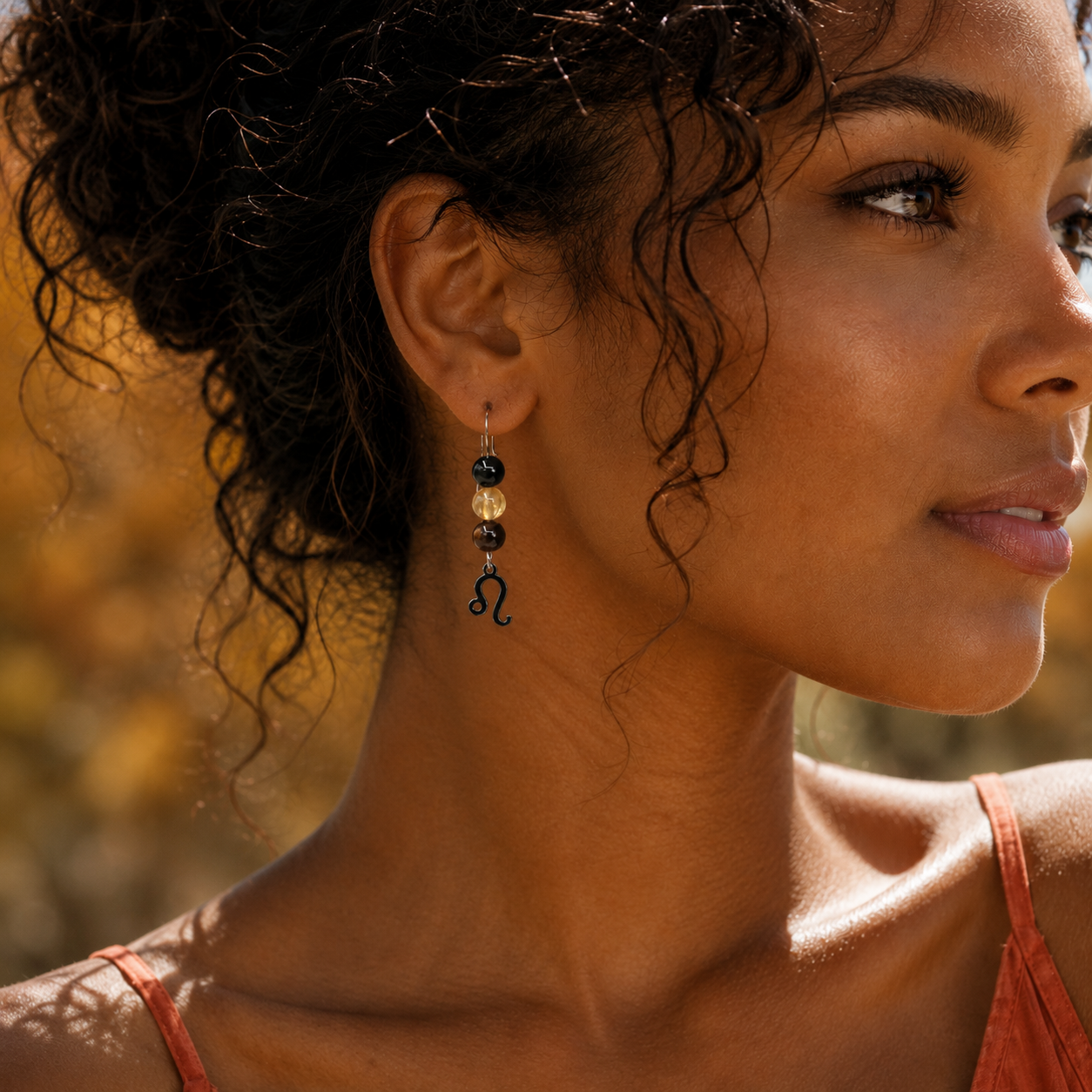 Let your light shine with Leo earrings featuring Tiger Eye, Citrine, and Onyx—a striking gemstone trio symbolizing confidence, radiance, and strength.Finished with a Leo symbolic charm and suspended from a hand-forged earwire.