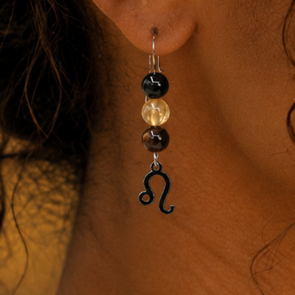 Let your light shine with Leo earrings featuring Tiger Eye, Citrine, and Onyx—a striking gemstone trio symbolizing confidence, radiance, and strength.Finished with a Leo symbolic charm and suspended from a hand-forged earwire.