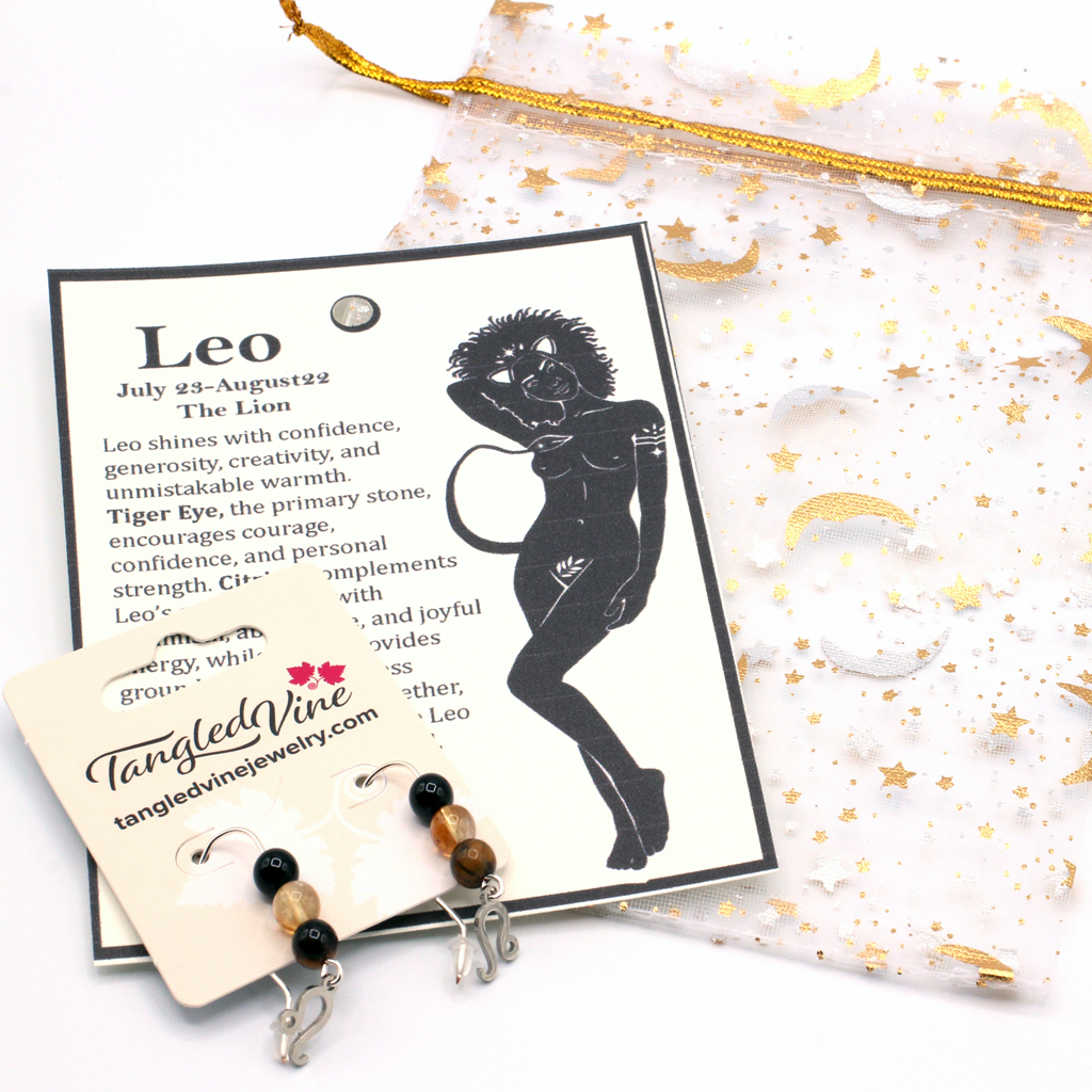 Let your light shine with Leo earrings featuring Tiger Eye, Citrine, and Onyx—a striking gemstone trio symbolizing confidence, radiance, and strength.Finished with a Leo symbolic charm and suspended from a hand-forged earwire.