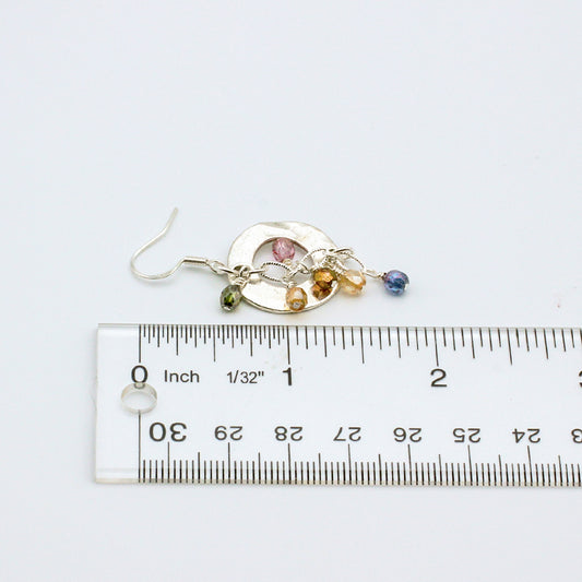 Soft pastel tones with these Bubbly Rose' earrings. Adorned with delicate crystals encircling a striking hammered disc centerpiece. 