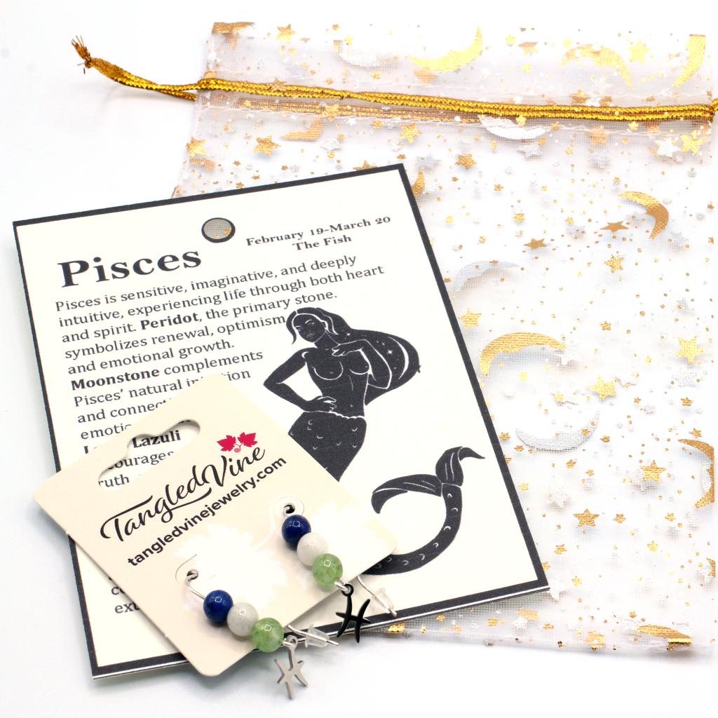 Celebrate the dreamy spirit of Pisces with earrings featuring Peridot, Moonstone, and Lapis Lazuli—a gemstone trio representing renewal, intuition, and inner wisdom. Finished with a Pisces symbolic charm and suspended from a hand-forged earwire.
