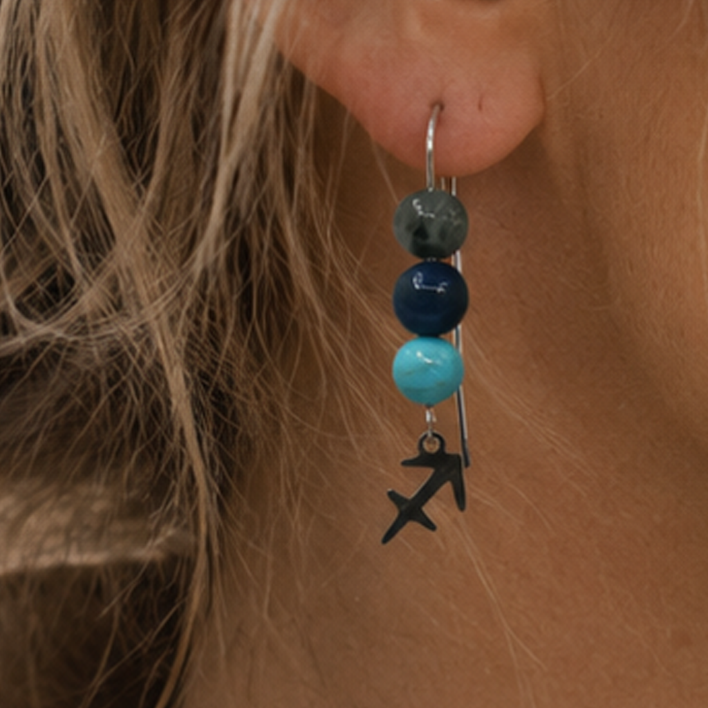 Celebrate the adventurous spirit of Sagittarius with earrings featuring Turquoise, Sodalite, and Labradorite—a gemstone trio representing adventure, truth, and discovery. Finished with a Sagittarius symbolic charm and suspended from a hand-forged earwire.