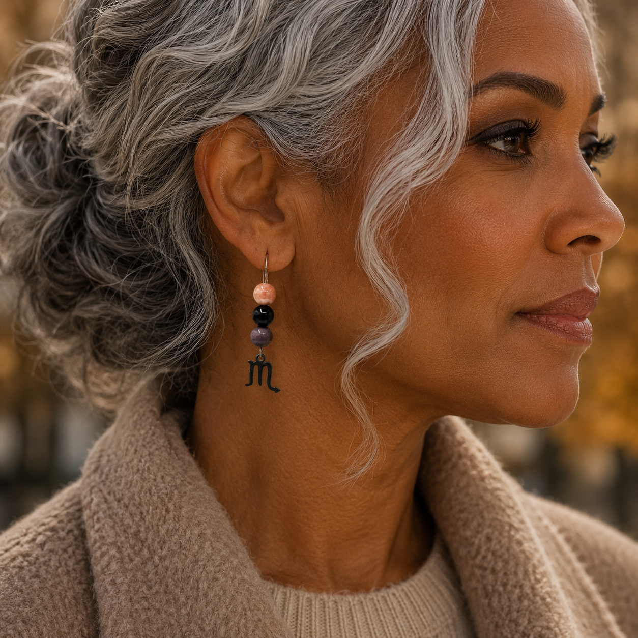 Embrace the captivating spirit of Scorpio with earrings featuring Rhodonite, Onyx, and Sunstone—a gemstone trio representing heart, strength, and transformation. Finished with a Scorpio symbolic charm and suspended from a hand-forged earwire.